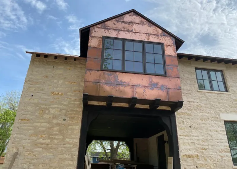 Copper metal panel facade on a stone building for Roof Repair in Massanetta Springs