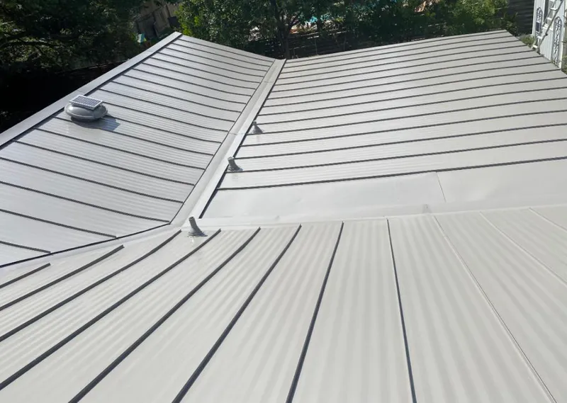 Solar attic fan installed on a metal roof for Roof Ventilation in Massanetta Springs